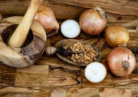 roasted onions on olive wood photo