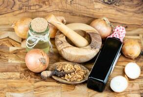 roasted onions on olive wood photo