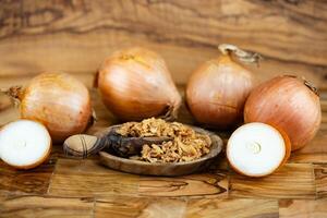 roasted onions on olive wood photo