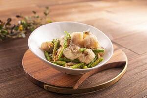 Crispy Fried Boneless Fish with Salt and Pepper served dish isolated on wooden table top view of Hong Kong food photo