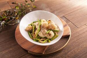 Crispy Fried Boneless Fish with Salt and Pepper served dish isolated on wooden table top view of Hong Kong food photo