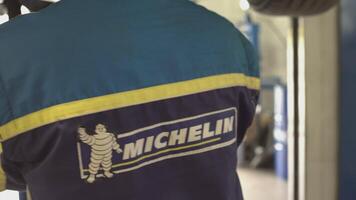 MILAN ITALY 6 MAY 2021 Mechanic with overalls Michelin video