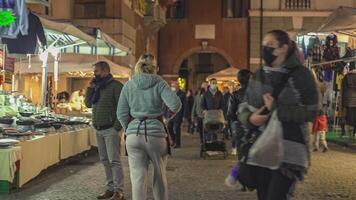 ROVIGO ITALY 30 OCTOBER 2021 People stroll the street market video