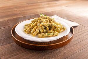 Golden Crispy Kidney Beans served dish isolated on wooden table top view of Hong Kong food photo