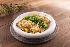 Xiang Wei Lao Eggplant with Minced Meat, Salted Egg Yolk, Minced Garlic, Chopped Coriander served dish isolated on wooden table top view of Hong Kong food photo