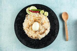 spicy Egg pulao, polao, biryani, mandi, kacchi with egg and salad served in dish isolated on table top view of indian food photo