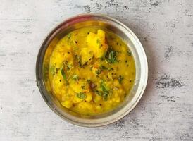 alu sabzi tarkari or potato vegetable served in a plate isolated on background top view of indian and pakistani desi food photo