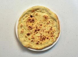 khamiri roti or khameeri roti served in a dish isolated on grey background top view of indian, pakistani food photo