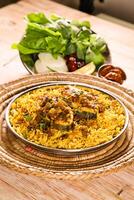 Bahari Kanaad biryani or fish biriyani served in dish isolated on table top view of arab food photo