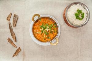 Lamb mughlai with white rice served in a dish isolated on table top view of indian spices food photo