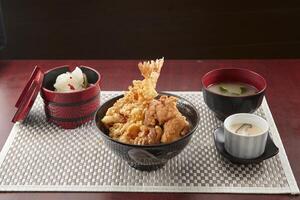 Fried Chicken and Ebi Manzoku Don served in a dish isolated on wooden table background side view of singapore food photo