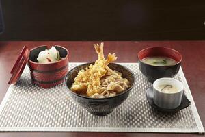 Pork Suki and Ebi Manzoku Don served in a dish isolated on wooden table background side view of singapore food photo