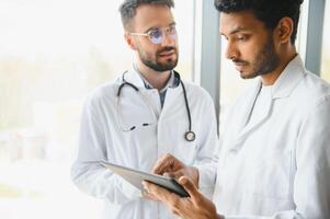 Two young male doctors in the clinic photo