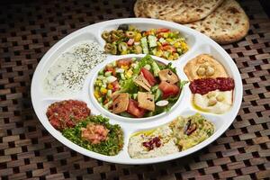 Marmaris Cold Mezza with Bread and salad served in dish isolated on table side view of middle east food photo