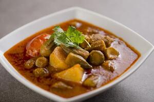 Khoresh Bamieh served in dish isolated on grey background top view of arabic food photo