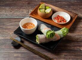 Signature Lettuce Wraps with lime and sauce served in bowl isolated on table top view of taiwan food photo