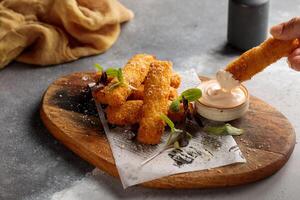 Chicken Alfrado Sticks with mayo dip served in dish isolated on table top view of arabic breakfast photo