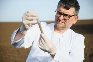 POV view of farmer owner control soil quality before seed plant. Future agriculture concept. photo