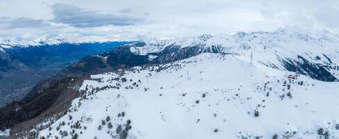 Winter Wonderland  Aerial View of Verbier, Switzerland Amid Snowy Peaks photo