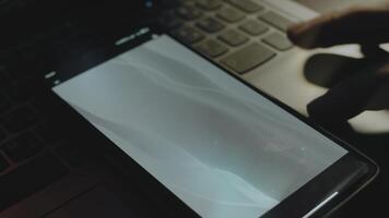 Abstract background of grey waves on smartphone screen. Rays of light come from screen. Male hand flapping with fingers cheerfully video