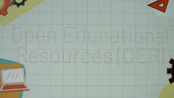 Open educational resources inscription on a eggshell color chalkboard with animated illustrations. Education concept. Blurred video