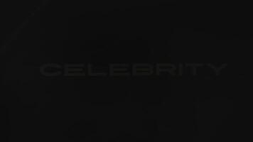 Celebrity news inscription of golden color on black background. Luxurious atmosphere. Graphic presentation with dynamically moving spot and sparkles. Entertainment concept video