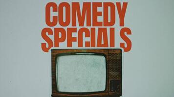 Comedy specials inscription on grey background with image of a vintage TV set, VHS effect on TV. Graphic presentation. Entertainment concept video