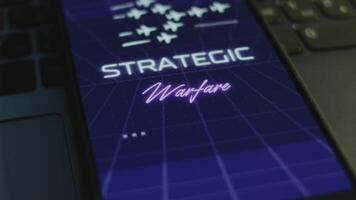 Strategic Warfare inscription on smartphone screen with dark blue background with linear perspective. Graphic presentation with flying military planes. Military concept. Light rays video