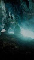 blue ice cave covered with snow and flooded with light video