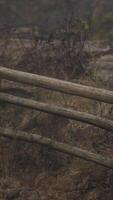 An old wood fence with a country field behind it video