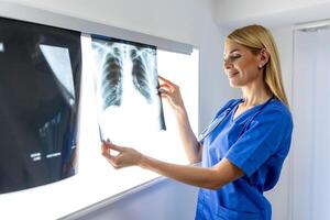 radiology and medicine concept. doctor explaining the results of scan lung on screen to senior patient. photo