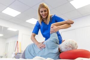 Senior woman having chiropractic back adjustment. Osteopathy, Alternative medicine, pain relief concept. Physiotherapy, injury rehabilitation photo