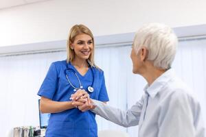 Emotional comfort stored in fingerprints. Shot of an unrecognizable doctor holding hands with her patient during a consultation. photo