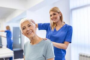 Licensed chiropractor or manual therapist doing neck stretch massage to relaxed female patient in clinic office. Young woman with whiplash or rheumatological problem getting professional doctor's help photo