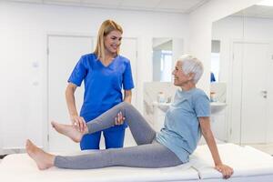 Senior woman having chiropractic back adjustment. Osteopathy, Alternative medicine, pain relief concept. Physiotherapy, injury rehabilitation photo