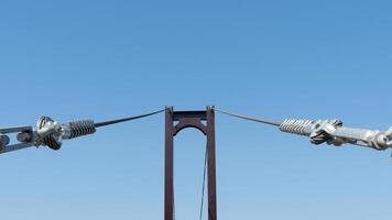 Large wire ropes that hold the bridge's steel structure. Background of clear sky. photo