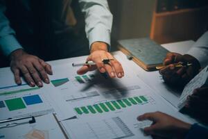 Business team meeting present, investor colleagues consultation and conference new strategy plan business and market growth on financial document graph report, Meeting and Talking. photo