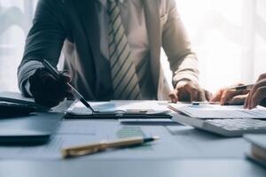 Business team meeting present, investor colleagues consultation and conference new strategy plan business and market growth on financial document graph report, Meeting and Talking. photo