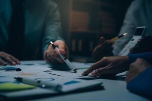 Business team meeting present, investor colleagues consultation and conference new strategy plan business and market growth on financial document graph report, Meeting and Talking. photo
