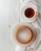 AI generated Top view of a cup of tea and a cheesecake photo