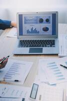 Meeting to present the Finance Executive business team. Discuss meetings to plan work, investment projects, analysis strategies, and discuss financial graphs and company budgets in the office. photo