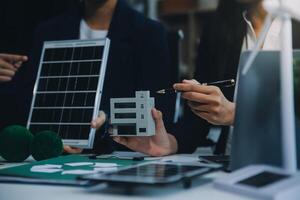 Carbon offset price report CO2 emission. Future growth Net zero waste in ESG ethical SME office protect climate change global warming social issues project. Group of asia people Eco friendly SDGs plan photo