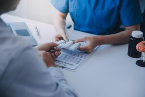 Doctor and patient are discussing consultation about symptom problem diagnosis of disease talk to the patient about medication and treatment method. photo