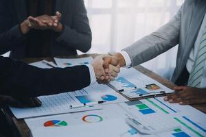 Business people accept or confirm project on the proposal and join shaking hands at office. photo