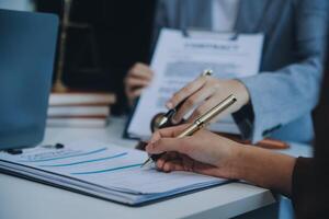 Businessman and lawyer discuss the contract document. Treaty of the law. Sign a contract business. photo