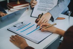 Businessman and lawyer discuss the contract document. Treaty of the law. Sign a contract business. photo