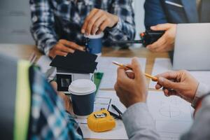 Image of engineer meeting for architectural project. working with partner and engineering tools on workplace vintage tone. photo