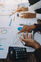 Business team collaboration discussing working analyzing with financial data and marketing growth report graph in team, presentation and brainstorming to strategy planning making profit of company. photo