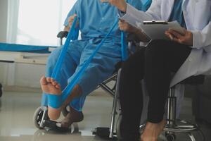 A physiotherapist doing treatment with patient in bright office photo