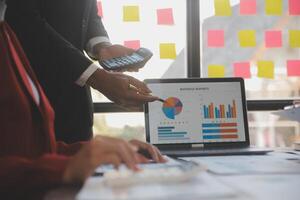 Finance manager meeting discussing company growth project success financial statistics, professional investor working start up project for strategy plan with document, laptop and digital tablet. photo